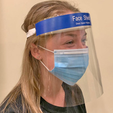 person wearing a face mask and face shield