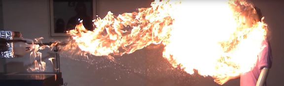 flame-jetting fireball erupting from a methanol bottle and engulfing a mannequin
